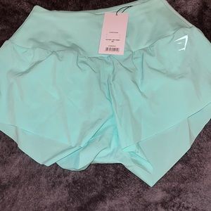 High waisted speed shorts with liner and zipper pocket on waist in back